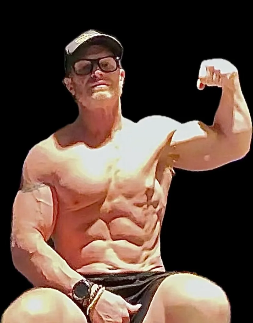Trevor flexing, seated