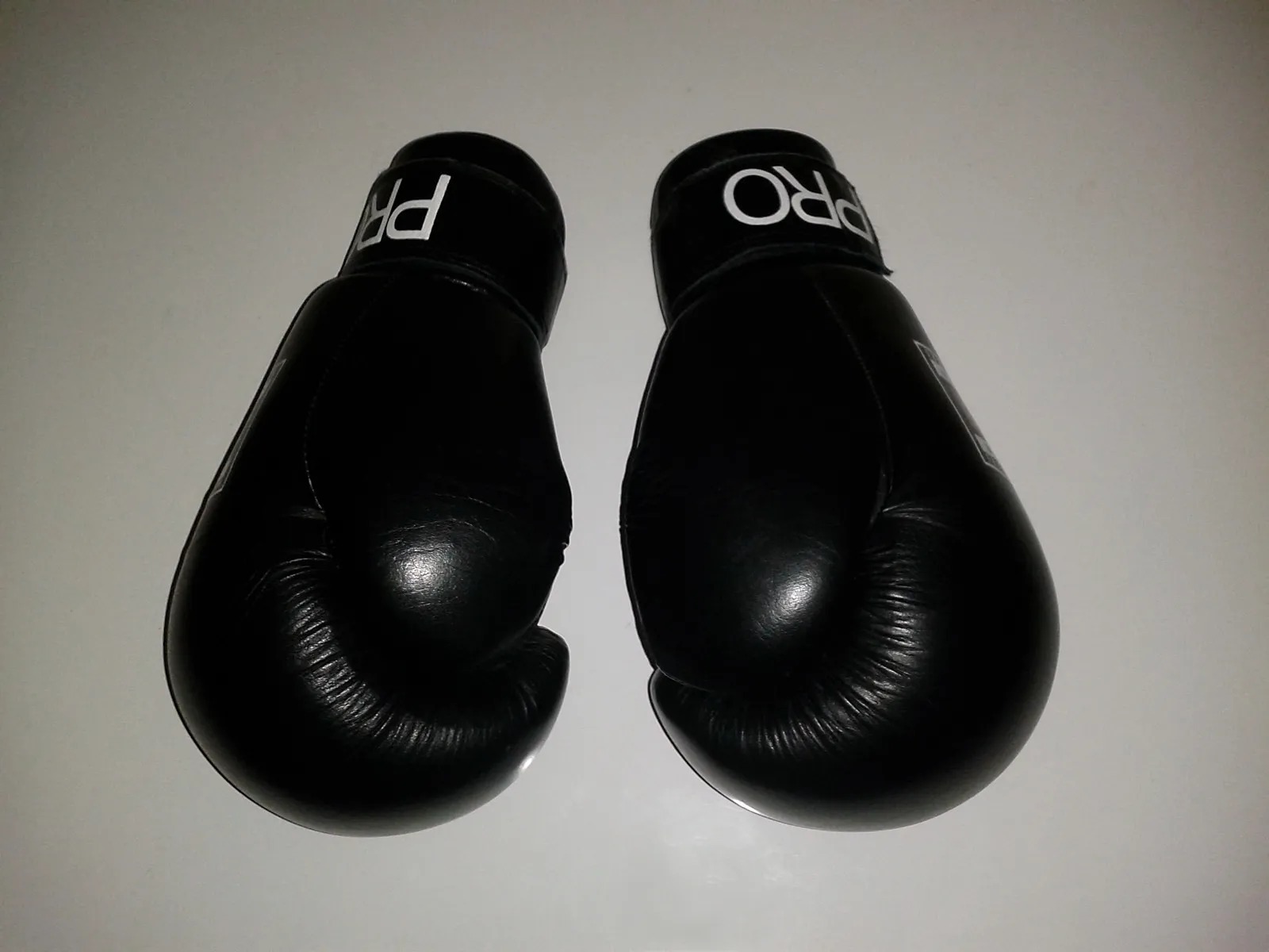 A pair of black boxing gloves